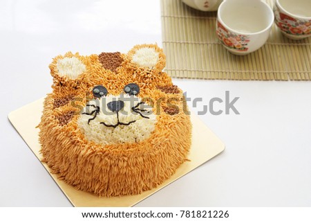tiger Birthday cakes with afternoon tea set on white background