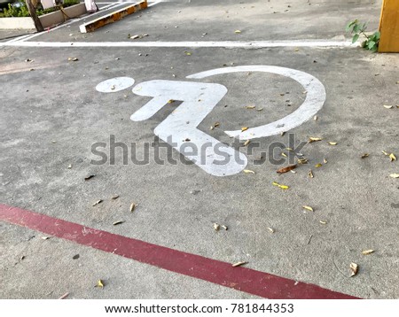 Disable sign on the floor, parking lot reserve for disable person.