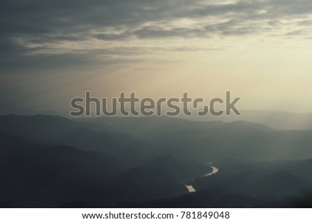 Beautiful landscape view in Nan province in Thailand with mountain, foggy, cloudy, when sun rise in the morning in the winter season.