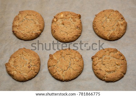 Six oatmeal cookies on parchment