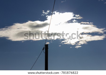 powerpole on december blue sky in south germany winter near city munich and stuttgart
