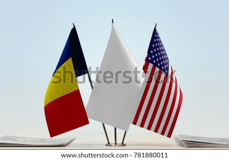 Flags of Chad and USA with a white flag in the middle