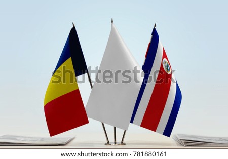 Flags of Chad and Costa Rica with a white flag in the middle
