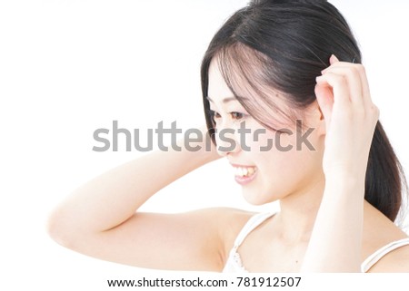 Young woman tying her hair