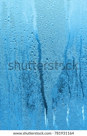 Natural condensation background. High humidity. Texture of water droplets on window
