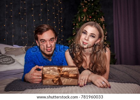 young couple in love in the New Year decorations