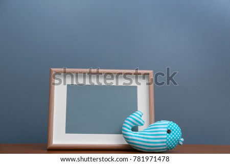 Child's room interior details on wooden table near color wall