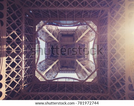 close up shot from under the Eiffel tower. Eiffel tower from below.