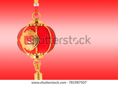 Red spherical shape lantern for Chinese New year decoration over red background.  The Chinese word means fortune.