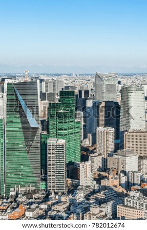 Asia Business concept for real estate and corporate construction - panoramic modern city skyline bird eye aerial view under sun and vivid blue sky in Roppongi Hill, Tokyo, Japan