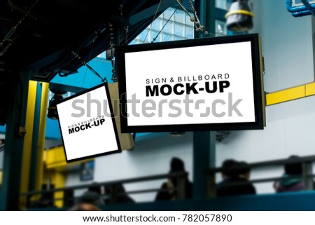 Two mock up white screen blank signboards for information or advertising indoor hanging on ceiling with clipping path at the amusement park, have many tourists in the area