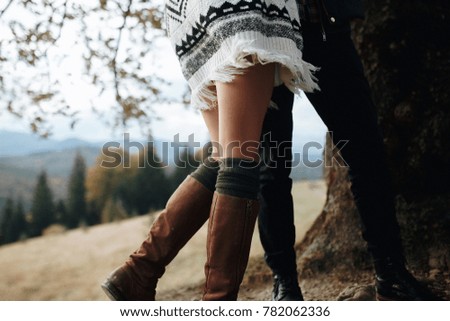Couple legs in the background of nature. Autumn picture. Lifestyle. Traveling together