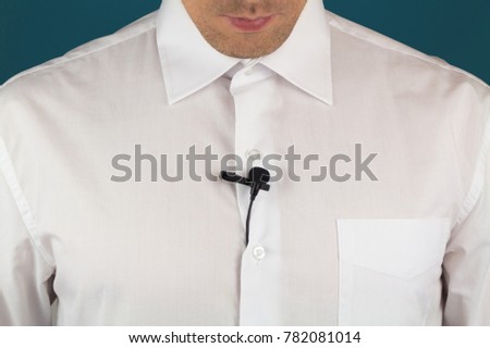 White man's shirt with lavalier microphone for interview