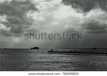 Storm clouds over the sea, black and white image.