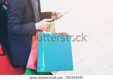 Happy shopping,male hand holding a shopping bag, businessman hands holding bags,