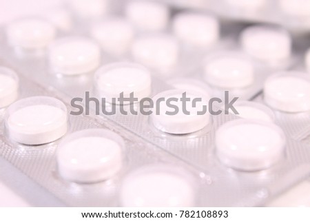 White round tablets in a package. Background. Texture. Royalty-Free Stock Photo #782108893
