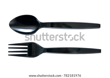 Plastic spoon and fork in black color isolated on white background
