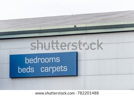 Day View of a Bedrooms Bed Carpets sign
