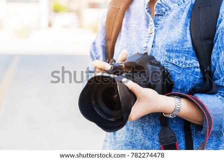 Women photography hold vintage camera