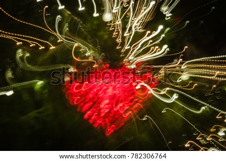 Glowing heart in the Dark. The picture is unclear.