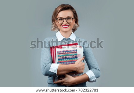 Portrait of young beautiful girl student with books 