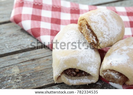 Turkish and Greek Kavala, Shortbread Cookies or Un Kurabiyesi on old wood background. Shortbread is a Scottish biscuit traditionally made from one part white sugar, butter, and flour. Copy Space Text.