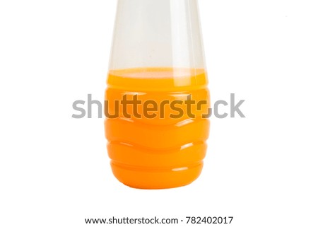 Orange juice in a plastic bottle on a white background