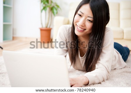 beautiful asian woman using laptop computer Royalty-Free Stock Photo #78240940