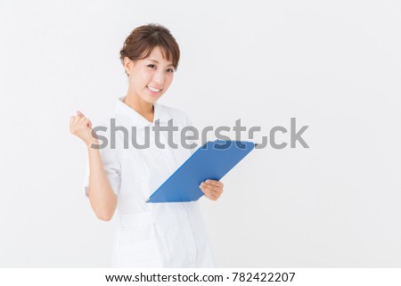 Young attractive asian nurse of the smile,interview sheet,
