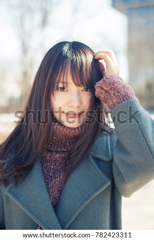 Beautiful Asian women smiling in the park