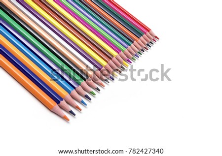 Coloured pencils arranged in a white background