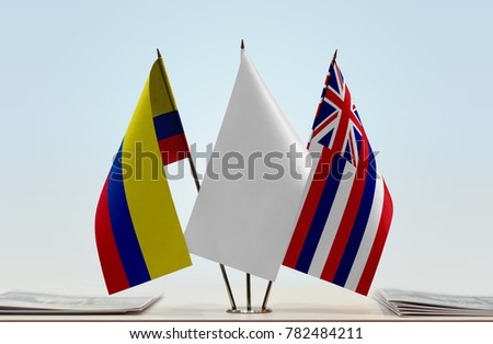 Flags of Colombia and Hawaii with a white flag in the middle