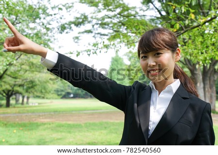 businesswoman pointing to something 