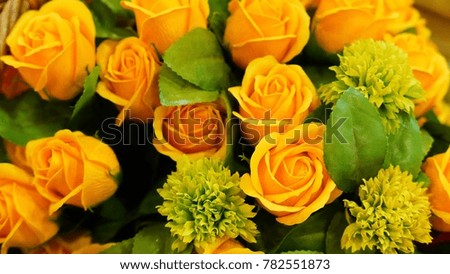 With yellow roses