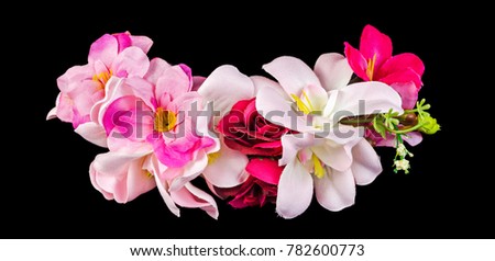 Artificial flowers isolated on black background. Clipping path included.