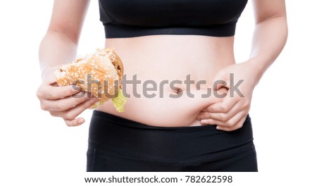 She pulls the hand skin showing fat in the abdomen and flanks with big hamburger in hand. 