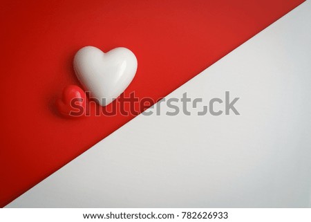 Valentine's hearts floating over red background with copy space. Symbol of love. Happy Valentines Day background concept.
