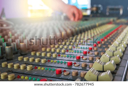 Mixer sound control concept. Hand control button sound mixer for music show festival. It volume level control for mixed sound to audience is melodic. Professional DJ to use for entertainment 