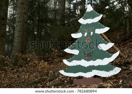 Christmas tree with lights in the woods 