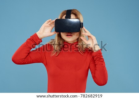  woman in 3d glasses on a pink background, virtual reality                              
