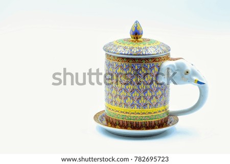 Antique porcelain mug with cover and saucer.