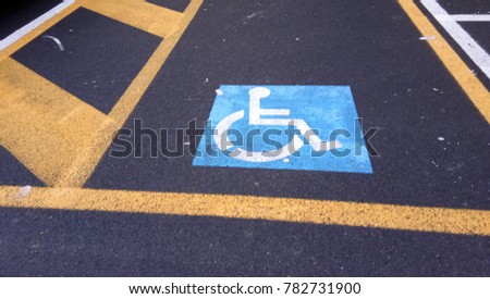 only handicapped parking sign on the asphalt ground
