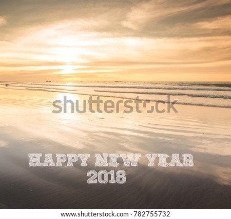 Words HAPPY NEW YEAR 2018 written on sunset seascape background. New Year 2018 Concept.