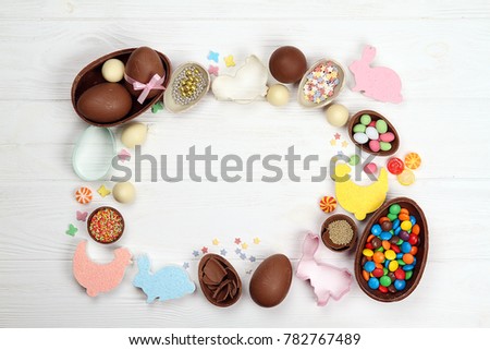 Chocolate Easter eggs figurine Easter bunny on a wooden background
