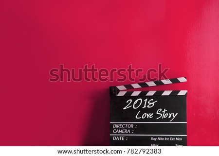 year 2018 love story title on wooden clapper board Royalty-Free Stock Photo #782792383