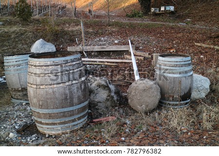 Old vintage wine barrel on the outdoor ground  
