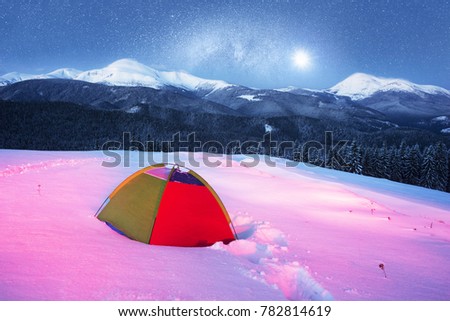 Houses of shepherds in the Carpathians, Ukraine, the trek in winter gives special extreme sensations of nature on top at night against the backdrop of the high ridge of Chernogory Goverla