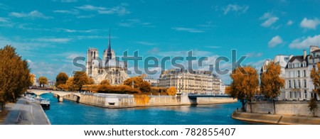 Paris, panorama over river Seine with Notre-Dame cathedral on a bright day in Fall. Toned image.