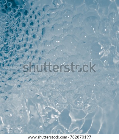 A pale blue water texture with bubble and ripple effect.