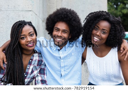 African american hipster man with two beautiful woman